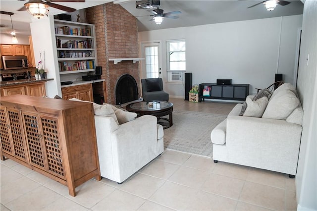 living room with light tile patterned floors, vaulted ceiling, a brick fireplace, and ceiling fan