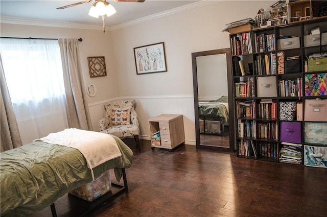 bedroom featuring baseboards, crown molding, and hardwood / wood-style floors