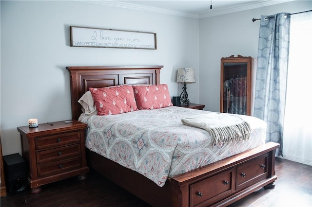 bedroom with wood finished floors and ornamental molding