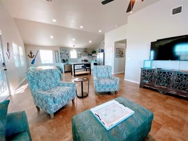 living room featuring ceiling fan and high vaulted ceiling