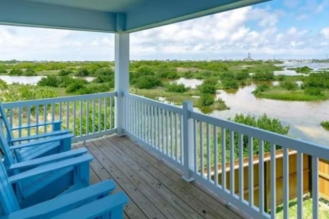 wooden deck featuring a water view