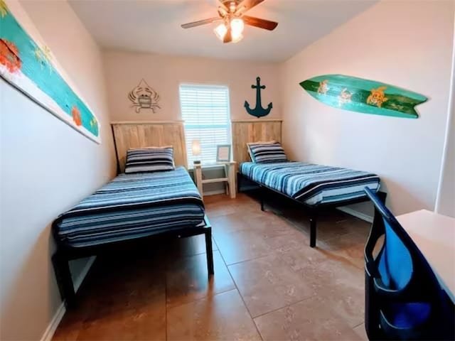 bedroom with tile patterned flooring and ceiling fan