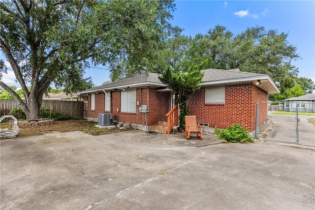 4114 Markins Dr, Corpus Christi, TX 78411 - view of front facade featuring brick siding and a patio area