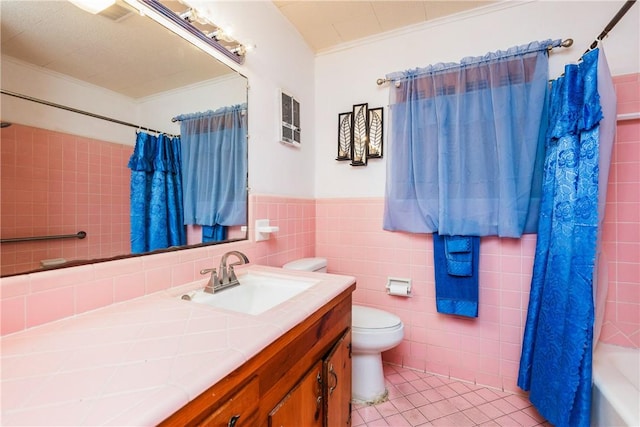 4114 Markins Dr, Corpus Christi, TX 78411 - full bathroom featuring vanity, tile patterned floors, shower / bath combo, ornamental molding, and tile walls