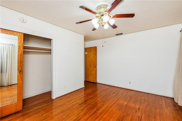 4114 Markins Dr, Corpus Christi, TX 78411 - unfurnished bedroom with wood finished floors, a closet, and ceiling fan