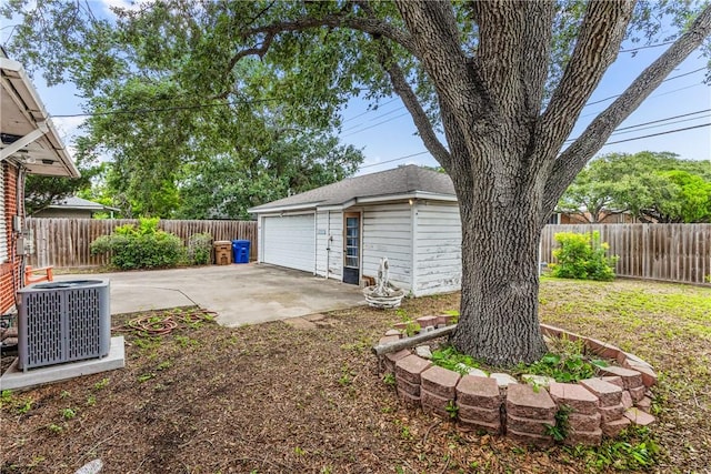 4114 Markins Dr, Corpus Christi, TX 78411 - fenced backyard with an outdoor structure, a garage, and a patio