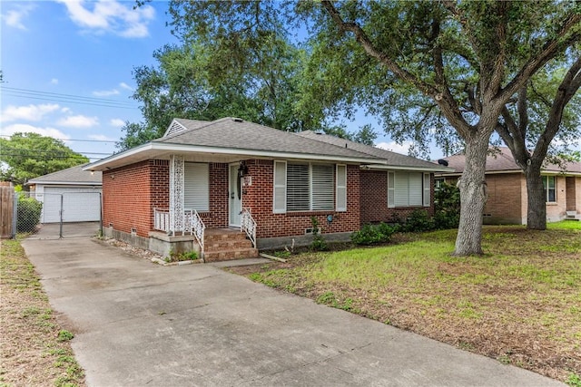 4114 Markins Dr, Corpus Christi, TX 78411 - view of front of home featuring brick siding, an outdoor structure, a porch, a garage, and a front yard