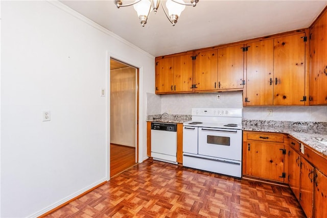 4114 Markins Dr, Corpus Christi, TX 78411 - kitchen featuring white appliances, light countertops, brown cabinetry, a chandelier, and crown molding