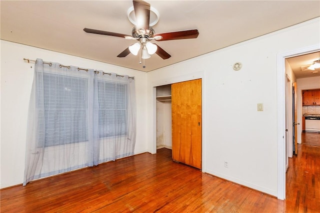 4114 Markins Dr, Corpus Christi, TX 78411 - unfurnished bedroom featuring wood finished floors, ceiling fan, and a closet