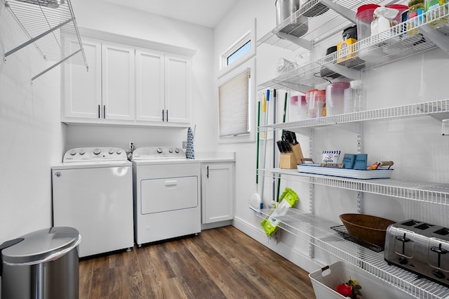 laundry room with independent washer and dryer, dark wood-type flooring, and cabinets