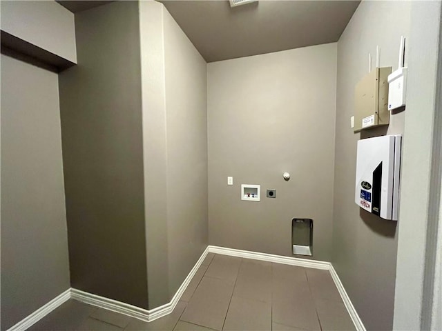 2212 Tallow Dr, Portland, TX 78374 - washroom featuring electric dryer hookup, washer hookup, tile patterned flooring, gas dryer hookup, and laundry area