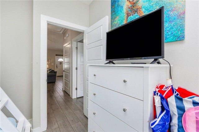 interior space with attic access and wood finished floors