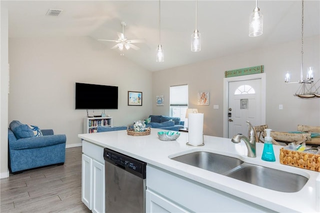 kitchen with visible vents, white cabinets, dishwasher, open floor plan, and a sink