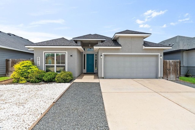 5810 Bella Di Giorno Dr, Corpus Christi, TX 78414 - view of front of home featuring stucco siding, an attached garage, driveway, and a shingled roof