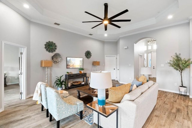 5810 Bella Di Giorno Dr, Corpus Christi, TX 78414 - living room featuring a high ceiling, light wood-type flooring, a ceiling fan, a tray ceiling, and recessed lighting
