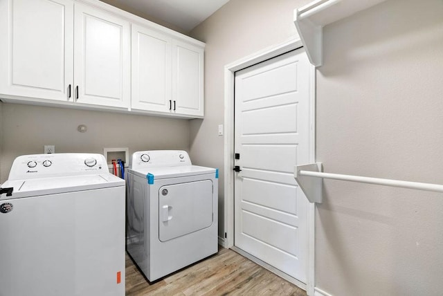 5810 Bella Di Giorno Dr, Corpus Christi, TX 78414 - laundry room with separate washer and dryer, cabinet space, and light wood-type flooring