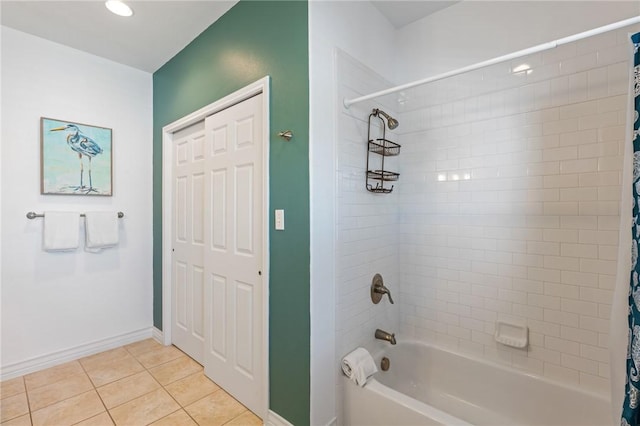 bathroom with tile patterned flooring and shower / tub combo