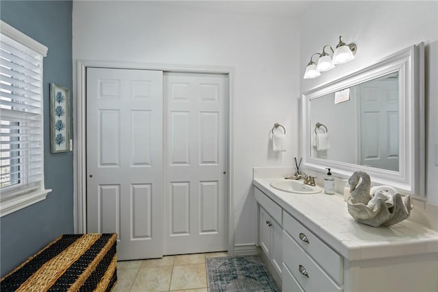 bathroom with tile patterned flooring and vanity