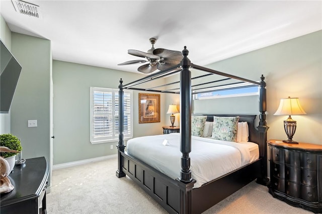 bedroom with light colored carpet and ceiling fan