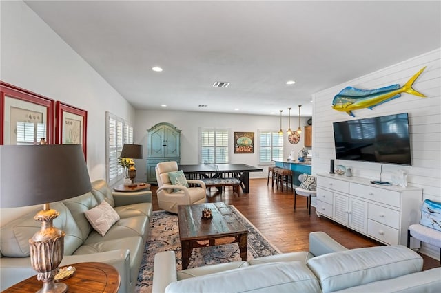 living room with dark hardwood / wood-style flooring