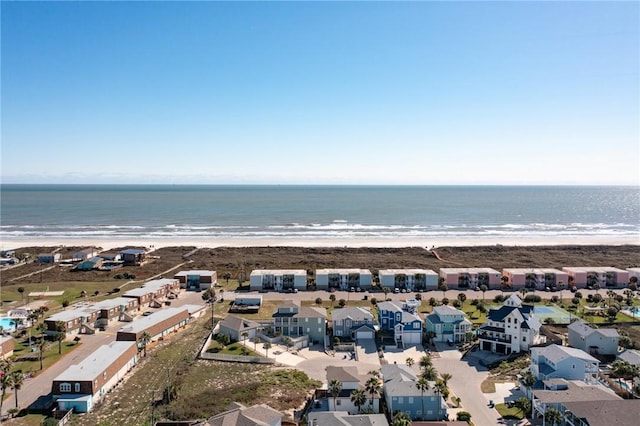 bird's eye view featuring a view of the beach and a water view