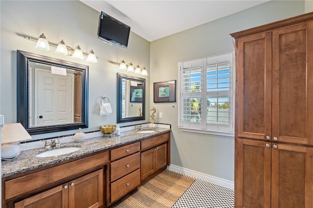 bathroom with tile patterned floors and vanity