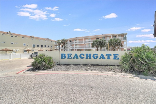 community sign featuring fence