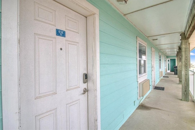 property entrance with covered porch