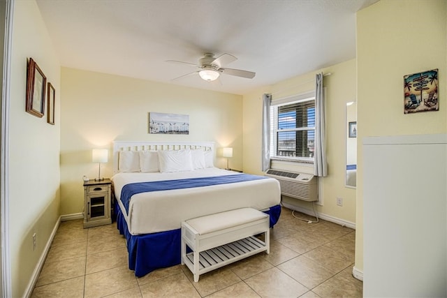 bedroom with light tile patterned floors, cooling unit, baseboards, and a ceiling fan