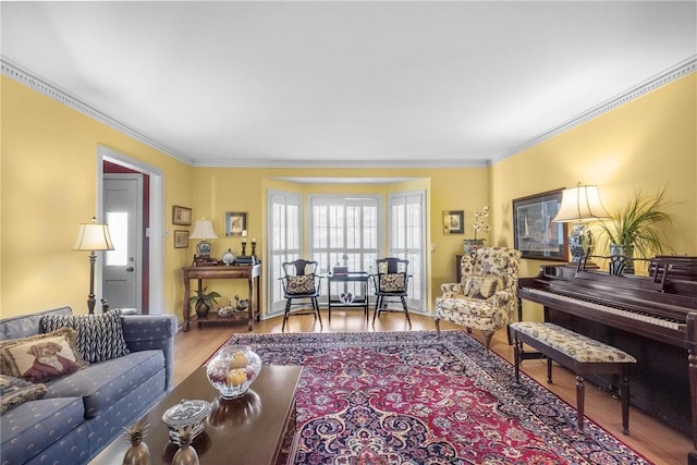 living room featuring ornamental molding and wood finished floors