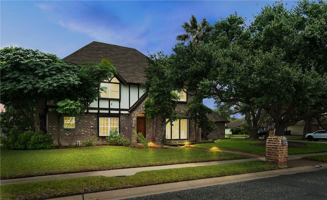 5222 Wooldridge, Corpus Christi, TX 78413 - tudor-style house with a front lawn, brick siding, and a shingled roof