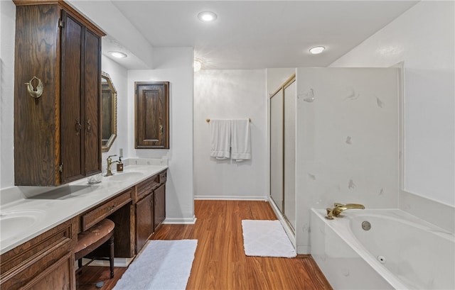 5222 Wooldridge, Corpus Christi, TX 78413 - bathroom with a stall shower, a tub with jets, double vanity, wood finished floors, and recessed lighting