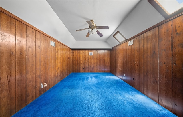 5222 Wooldridge, Corpus Christi, TX 78413 - unfurnished room with wood walls, ceiling fan, carpet flooring, and lofted ceiling