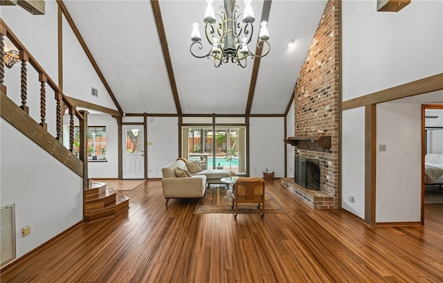 5222 Wooldridge, Corpus Christi, TX 78413 - living area featuring high vaulted ceiling, plenty of natural light, a fireplace, a chandelier, and beam ceiling