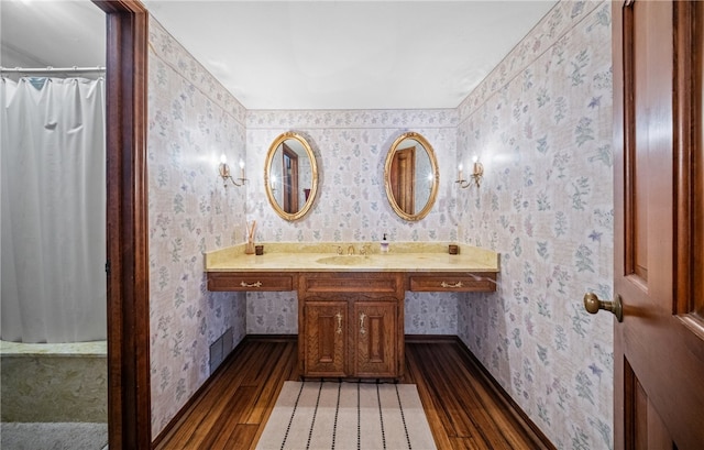 5222 Wooldridge, Corpus Christi, TX 78413 - bathroom featuring wood finished floors, wallpapered walls, vanity, and a shower with curtain