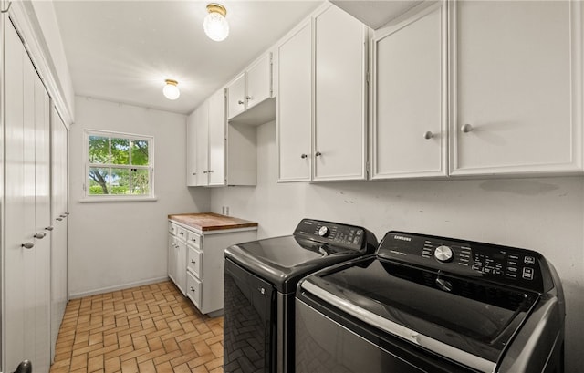 5222 Wooldridge, Corpus Christi, TX 78413 - laundry room with washing machine and clothes dryer, cabinet space, and brick patterned floors