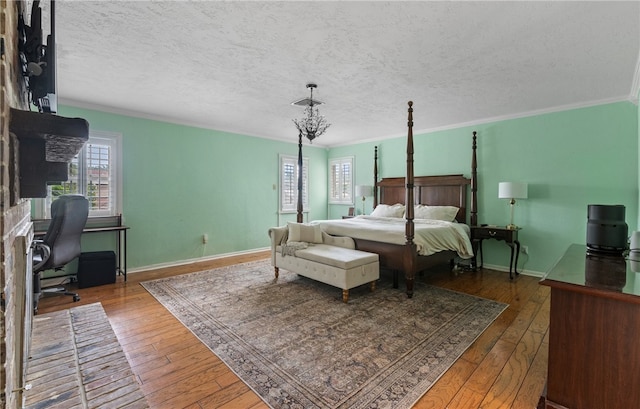 5222 Wooldridge, Corpus Christi, TX 78413 - bedroom featuring hardwood / wood-style flooring, an office area, ornamental molding, and a textured ceiling