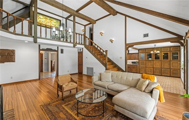 5222 Wooldridge, Corpus Christi, TX 78413 - living room with a chandelier, high vaulted ceiling, stairway, beamed ceiling, and wood finished floors