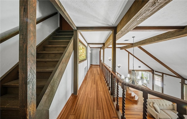 5222 Wooldridge, Corpus Christi, TX 78413 - hall featuring wood finished floors, a chandelier, and stairway