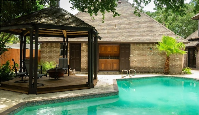 5222 Wooldridge, Corpus Christi, TX 78413 - swimming pool featuring a gazebo, an outdoor fire pit, and a deck