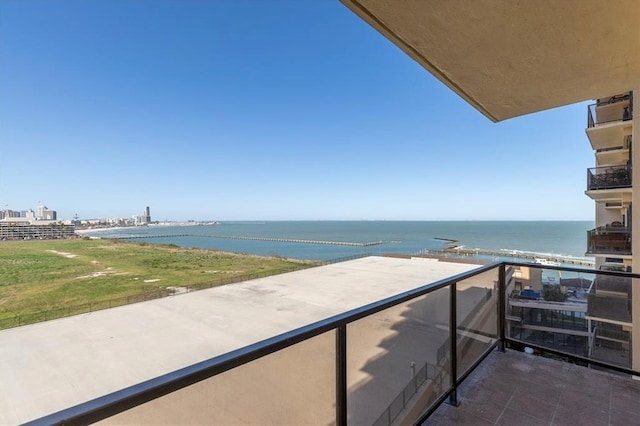 balcony featuring a water view