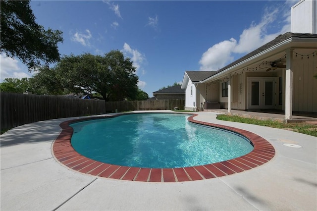 4010 Moorhead Dr, Corpus Christi, TX 78410 - view of swimming pool with french doors, a fenced backyard, a patio area, and a ceiling fan