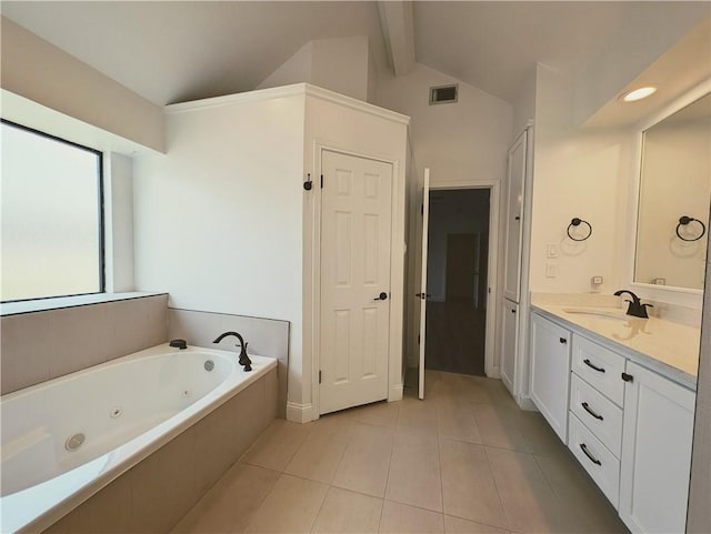 4010 Moorhead Dr, Corpus Christi, TX 78410 - bathroom featuring vanity, tile patterned flooring, a tub with jets, and a closet