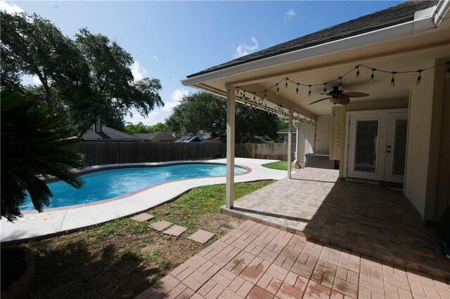 4010 Moorhead Dr, Corpus Christi, TX 78410 - view of swimming pool featuring french doors, a ceiling fan, a fenced backyard, and a patio area