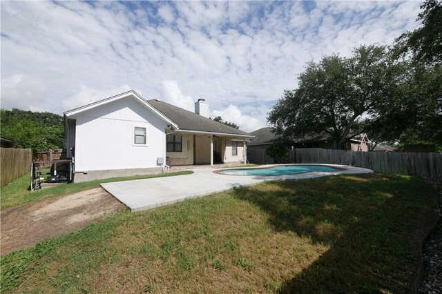 4010 Moorhead Dr, Corpus Christi, TX 78410 - rear view of house featuring a patio, a fenced backyard, and a chimney