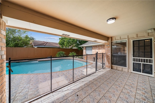 view of pool featuring a patio