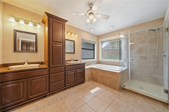 bathroom with vanity, plus walk in shower, tile patterned flooring, and ceiling fan