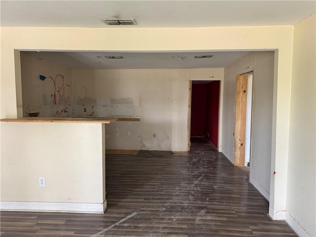 423 S 13th St, Kingsville, TX 78363 - kitchen featuring dark wood finished floors
