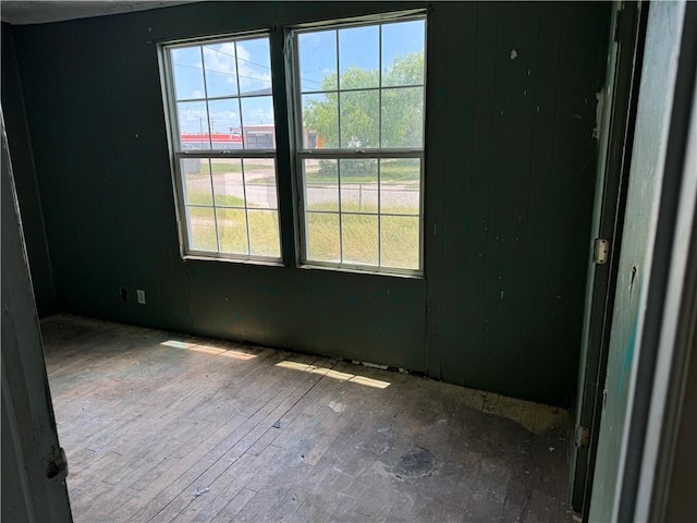 423 S 13th St, Kingsville, TX 78363 - spare room featuring plenty of natural light and wood-type flooring
