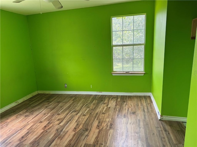 423 S 13th St, Kingsville, TX 78363 - unfurnished room featuring dark wood finished floors and a ceiling fan